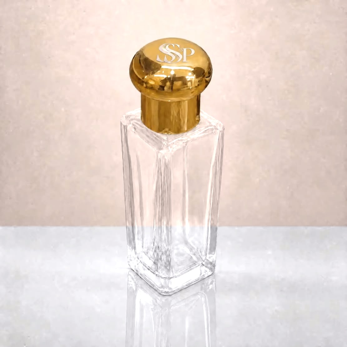 Sacred Veil Aura Mist 30mL, clear square bottle with a gold lid engraved with the SSP monogram